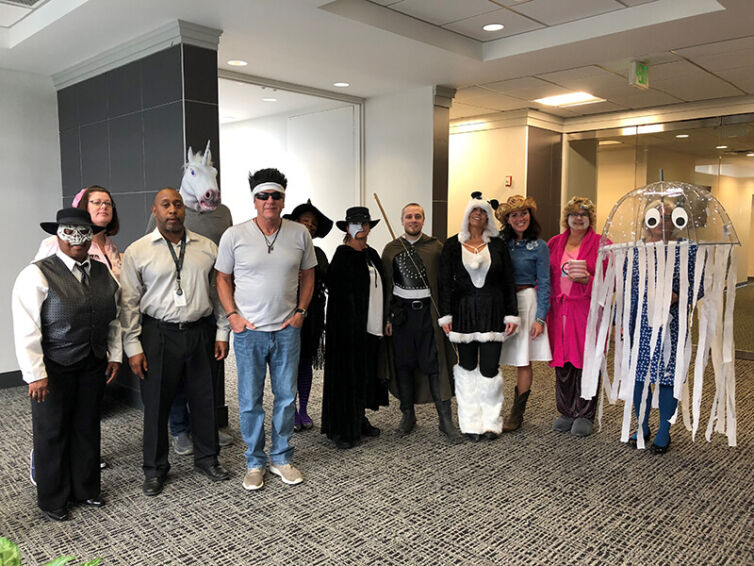 COMSO employees in Halloween costumes