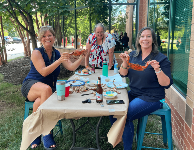 COMSO employees enjoying crabs at our first annual crab feast!